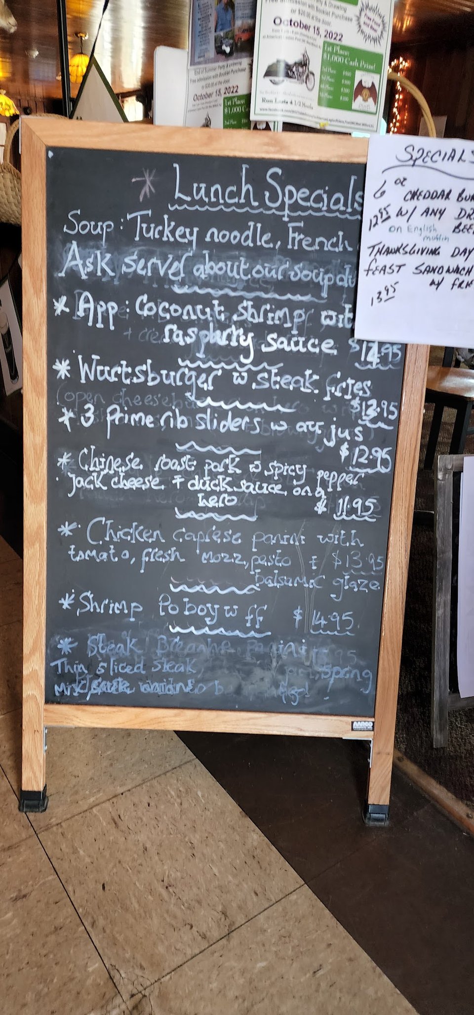 Printed menu beside bar drinks and desserts